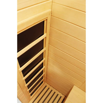 Wooden sauna interior with bench and glass door
