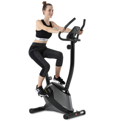 Woman exercising on a stationary exercise bike 
