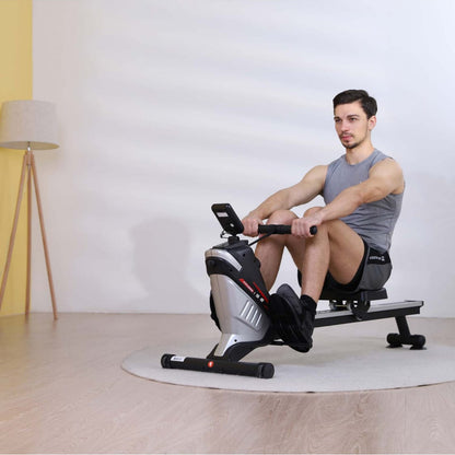 Man exercising on Magnetic Rowing Machine with Vertical Storage