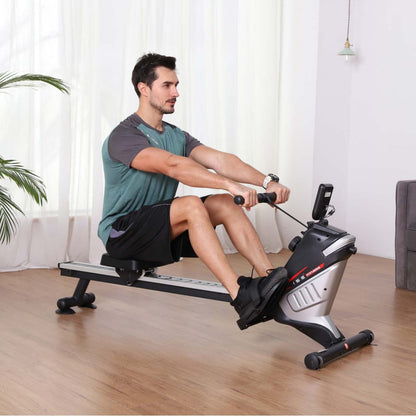 Man using a rowing machine in a home 